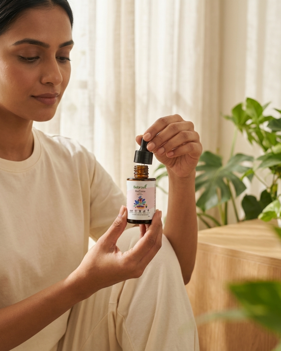 Woman holding a bottle of natural skincare product with a blurred background